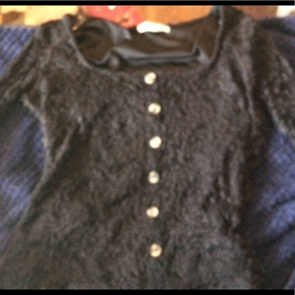A long sleeve button lace top